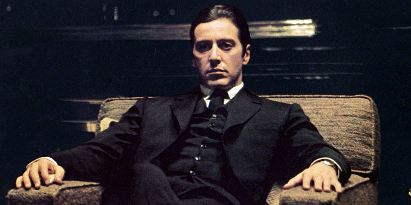 Al Pacino sitting in a chair in The Godfather Part II.