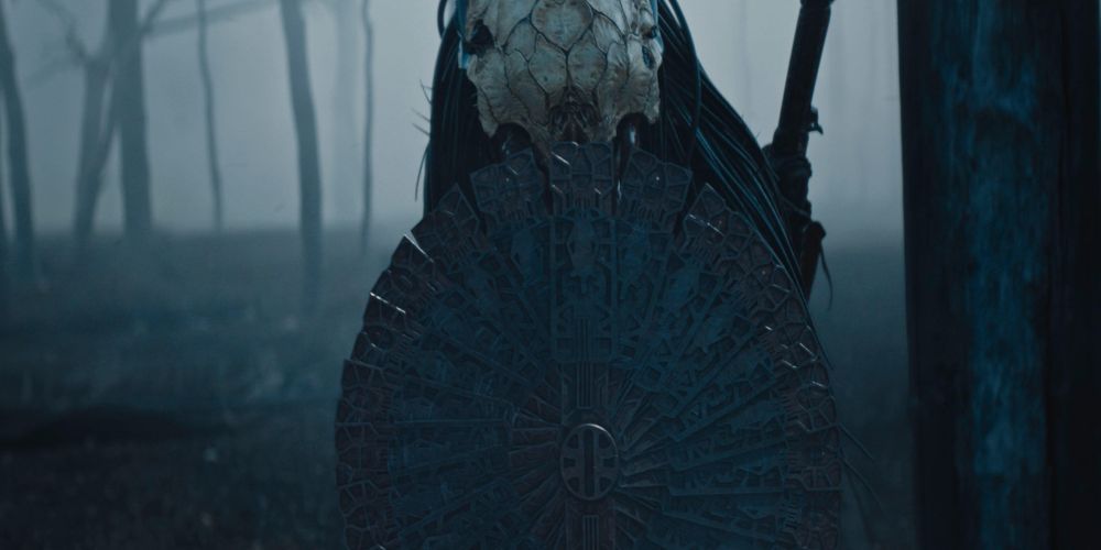 The Predator wears a bear skull and hides behind a shield in Prey