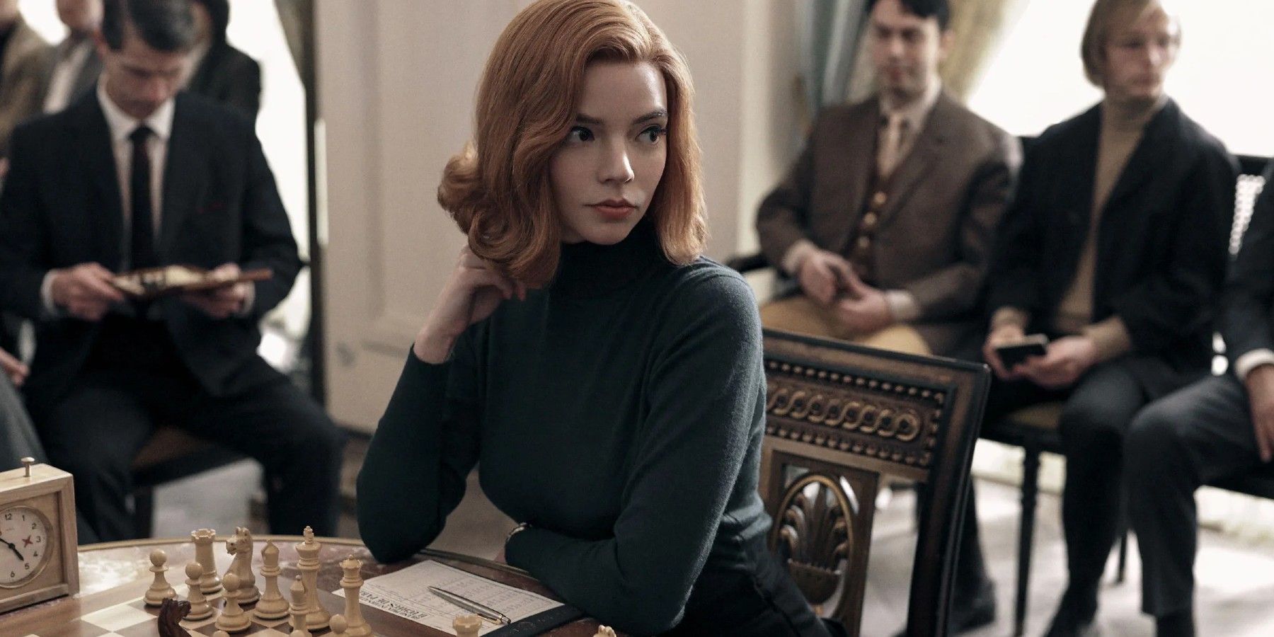 Anya Taylor Joy sitting at a chess board in The Queen's Gambit