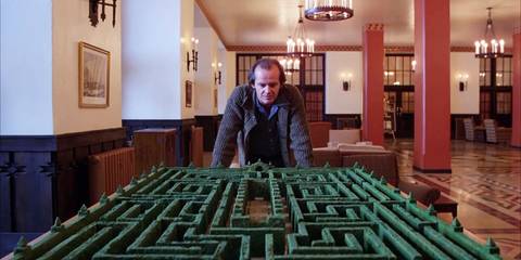 Jack (Jack Nicholson) looks at a replica of the maze from The Shining 