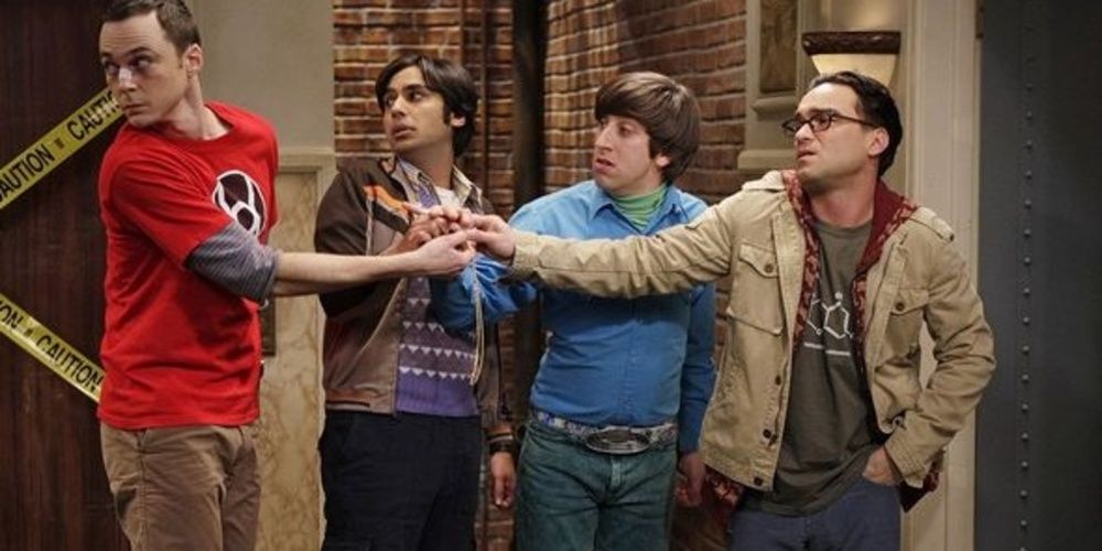 Os caras segurando o Um Anel em The Big Bang Theory