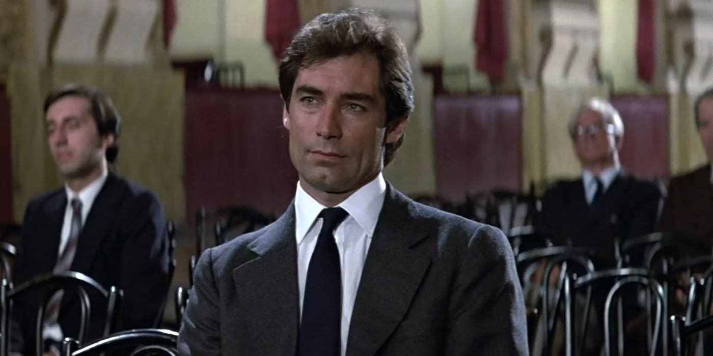 Timothy Dalton as James Bond wearing a suit