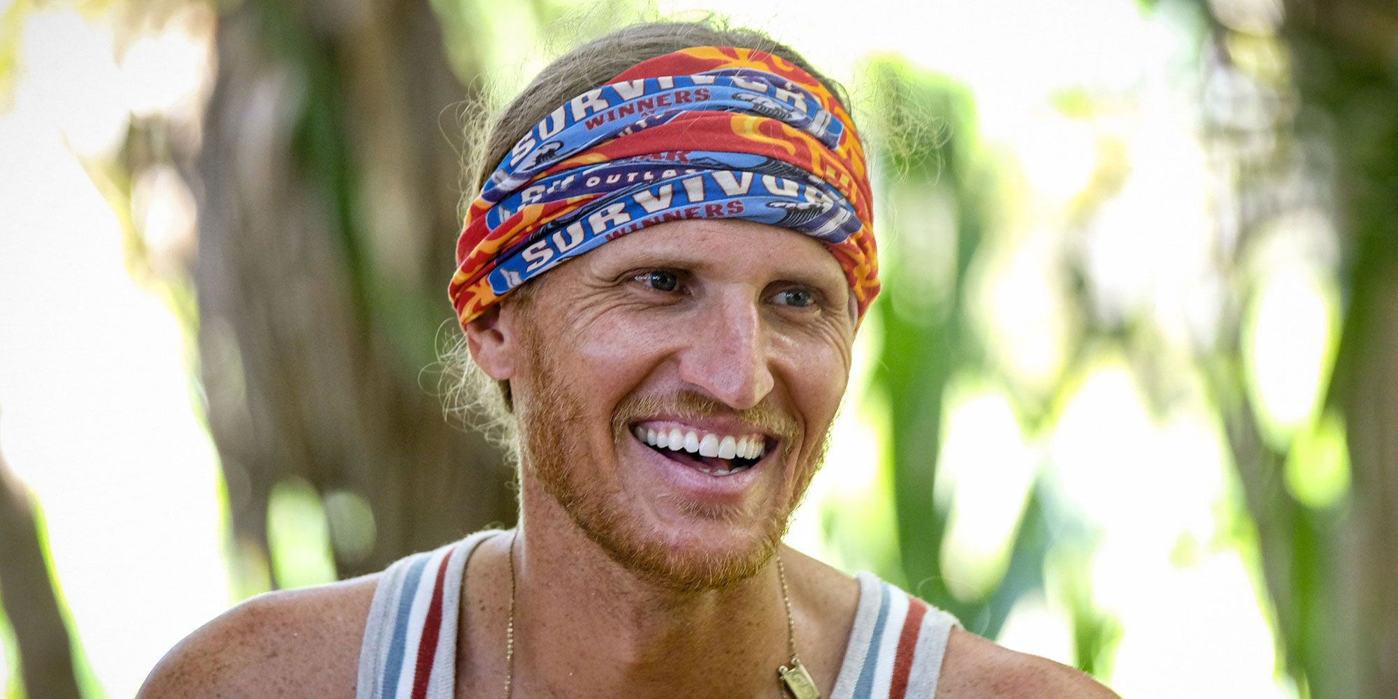 Tyson-Apostol smiling at the jungle in Survivor.