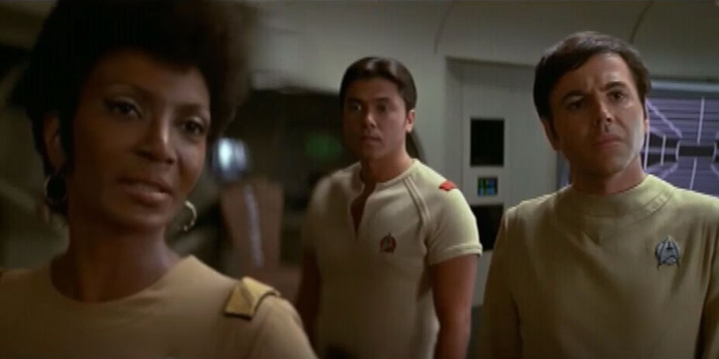 Image of Uhura, Chekov and a unknown officer on the bridge looking to another officer