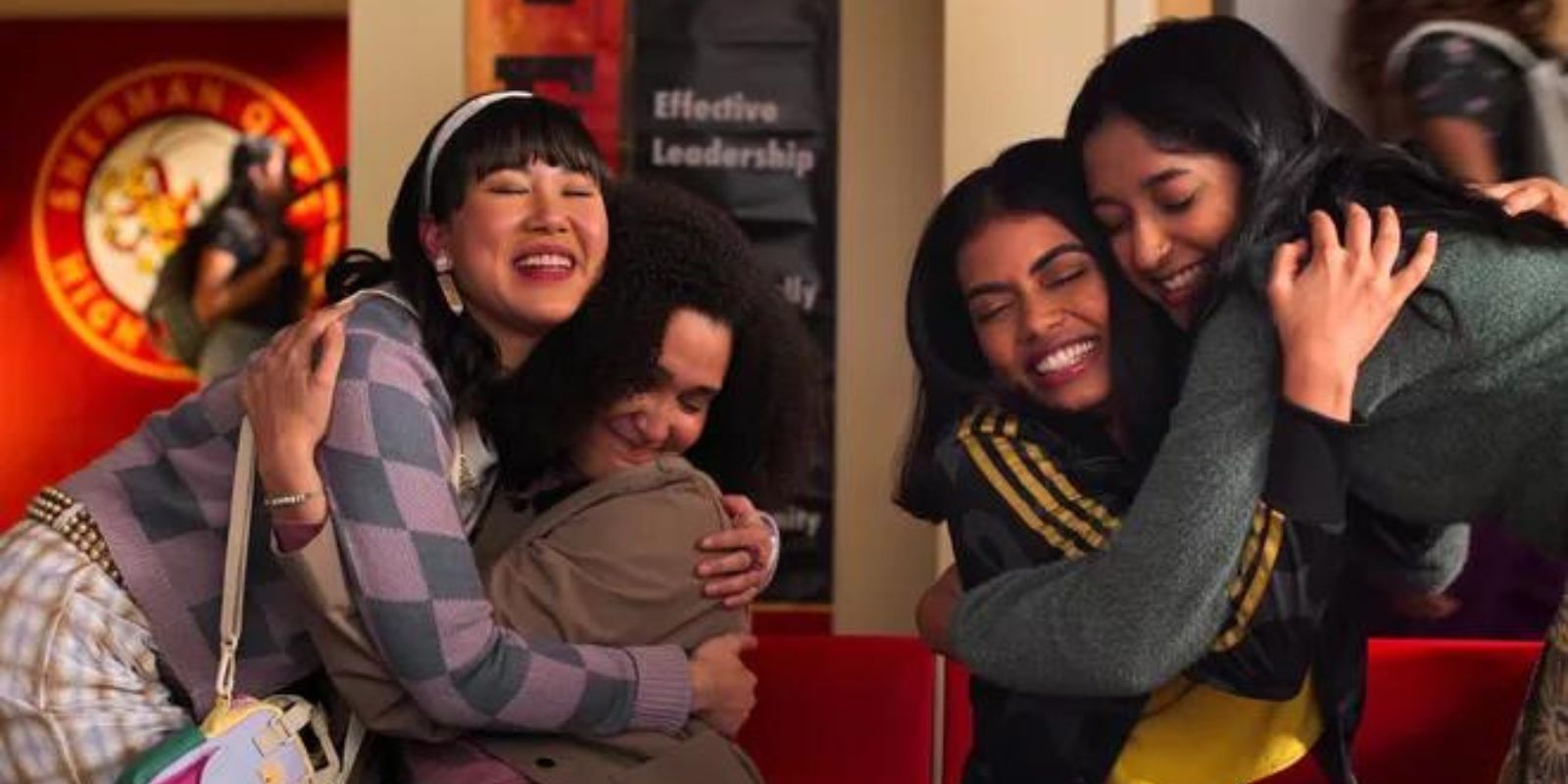 Devi and her friends hug one another in school