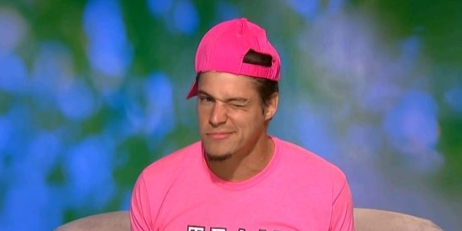 Zach wearing pink and winking in diary room