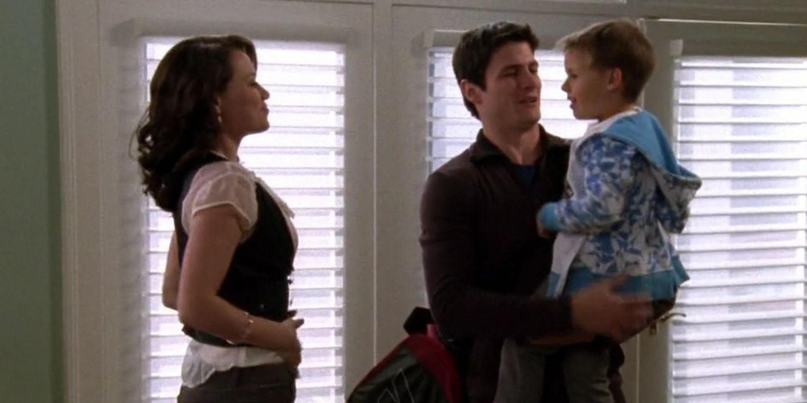 Haley looks over at Nathan holding Jamie