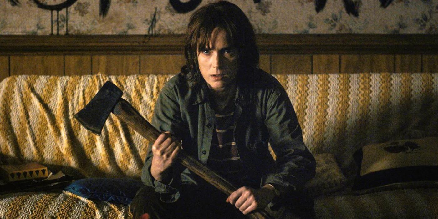 Joyce holding an ax and looking determined in Stranger Things