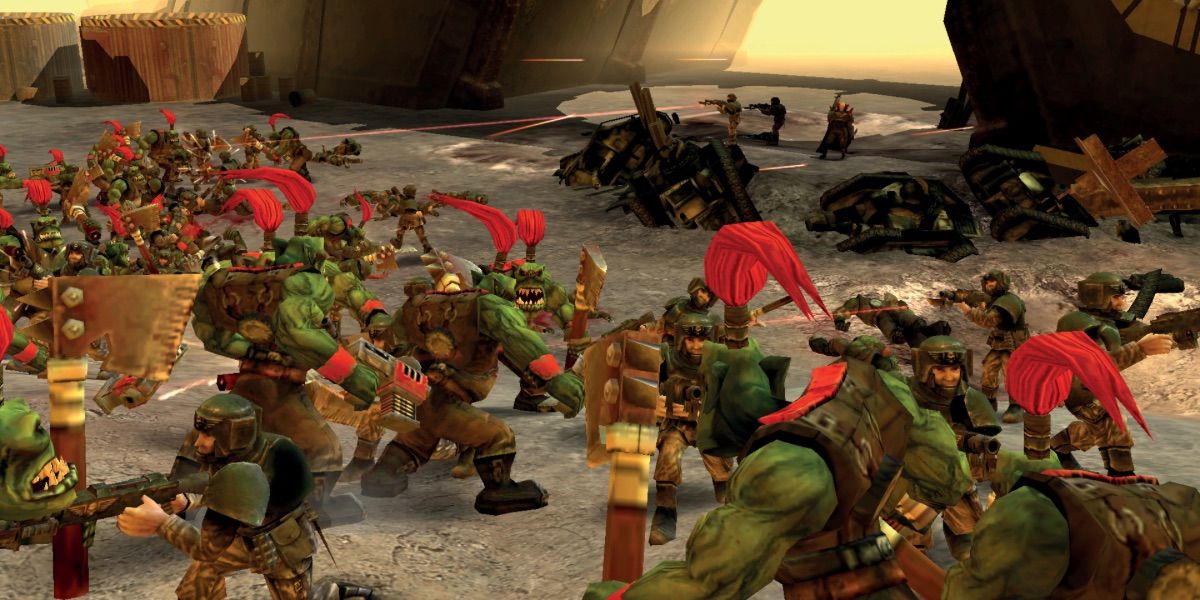 An army of Orcs march into battle from Warhammer 40k Dawn of War