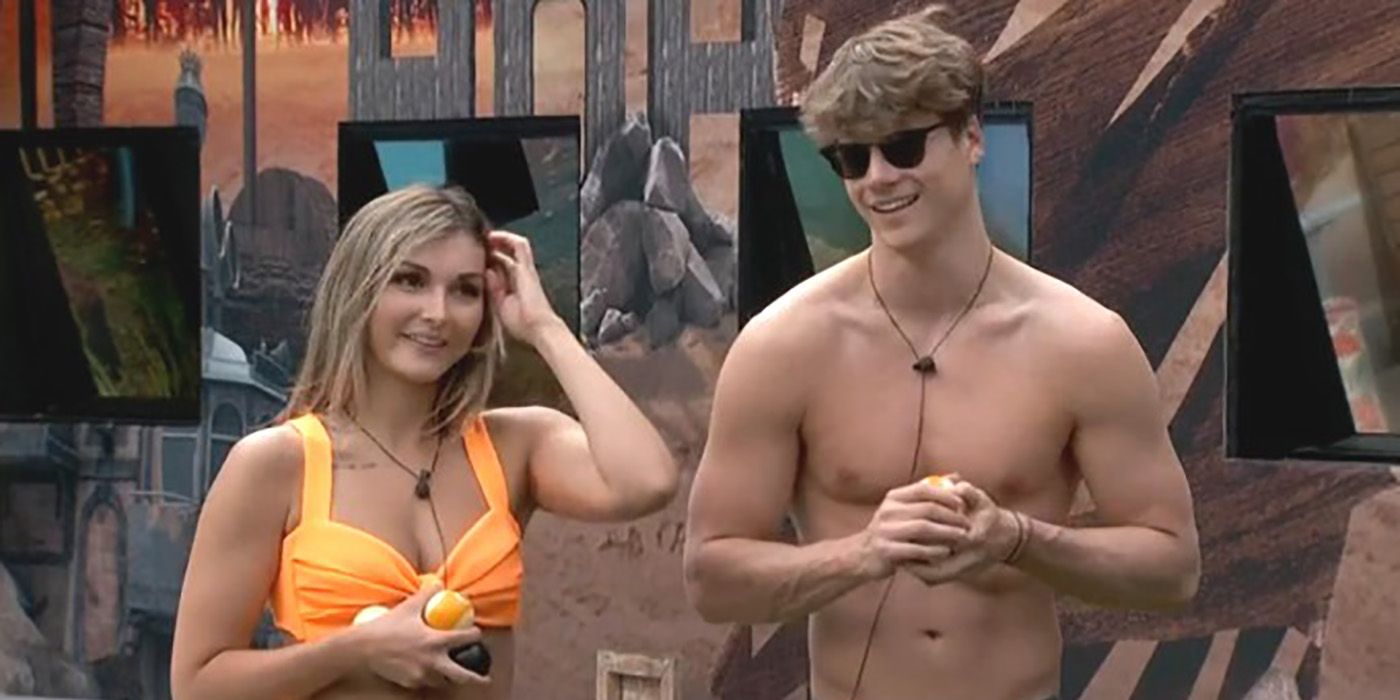 Alyssa and Kyle from Big Brother 24 standing outside in the backyard, smiling.