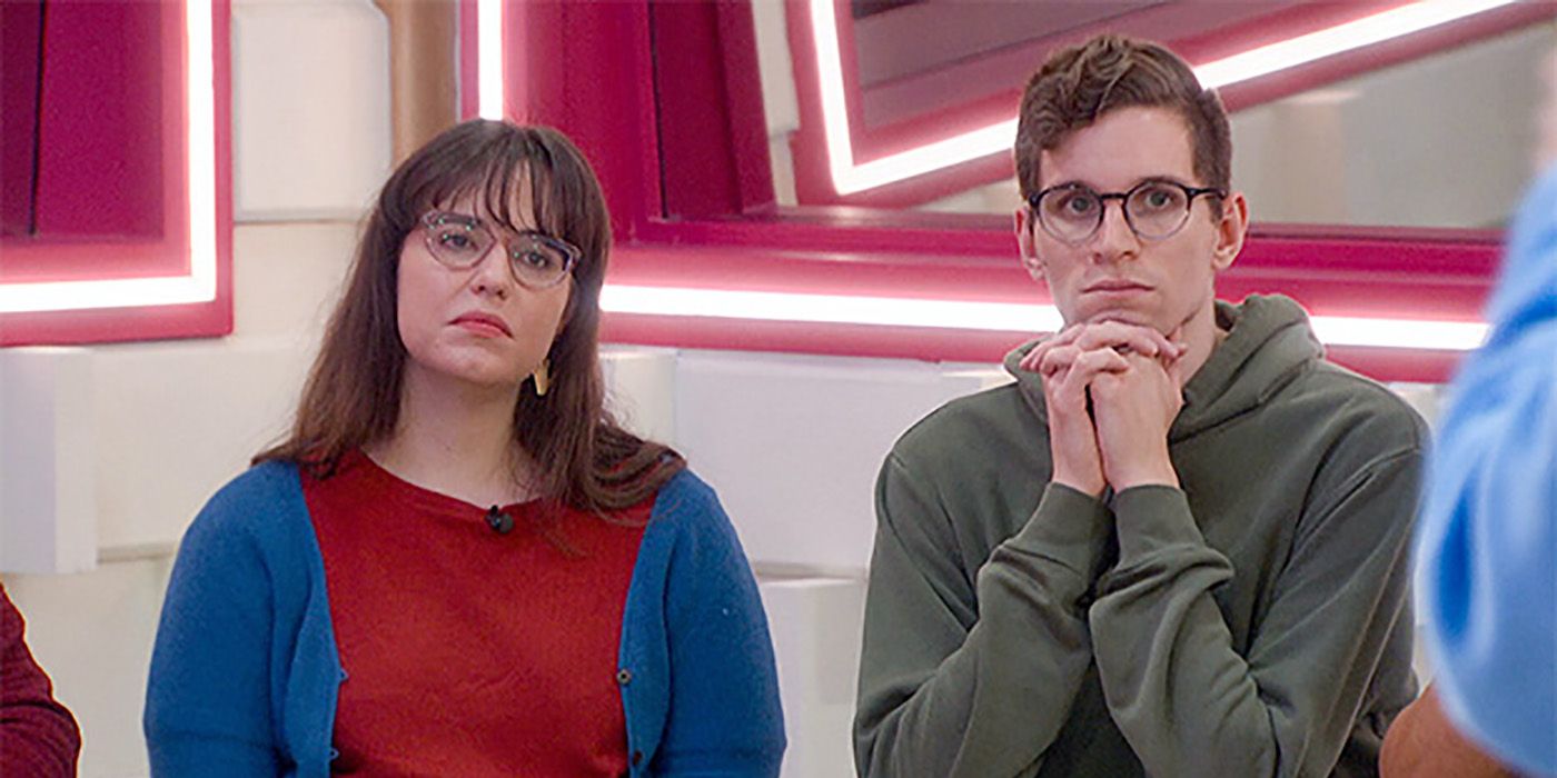 Brittany and Michael sitting together in the kitchen on Big Brother 24, looking serious.