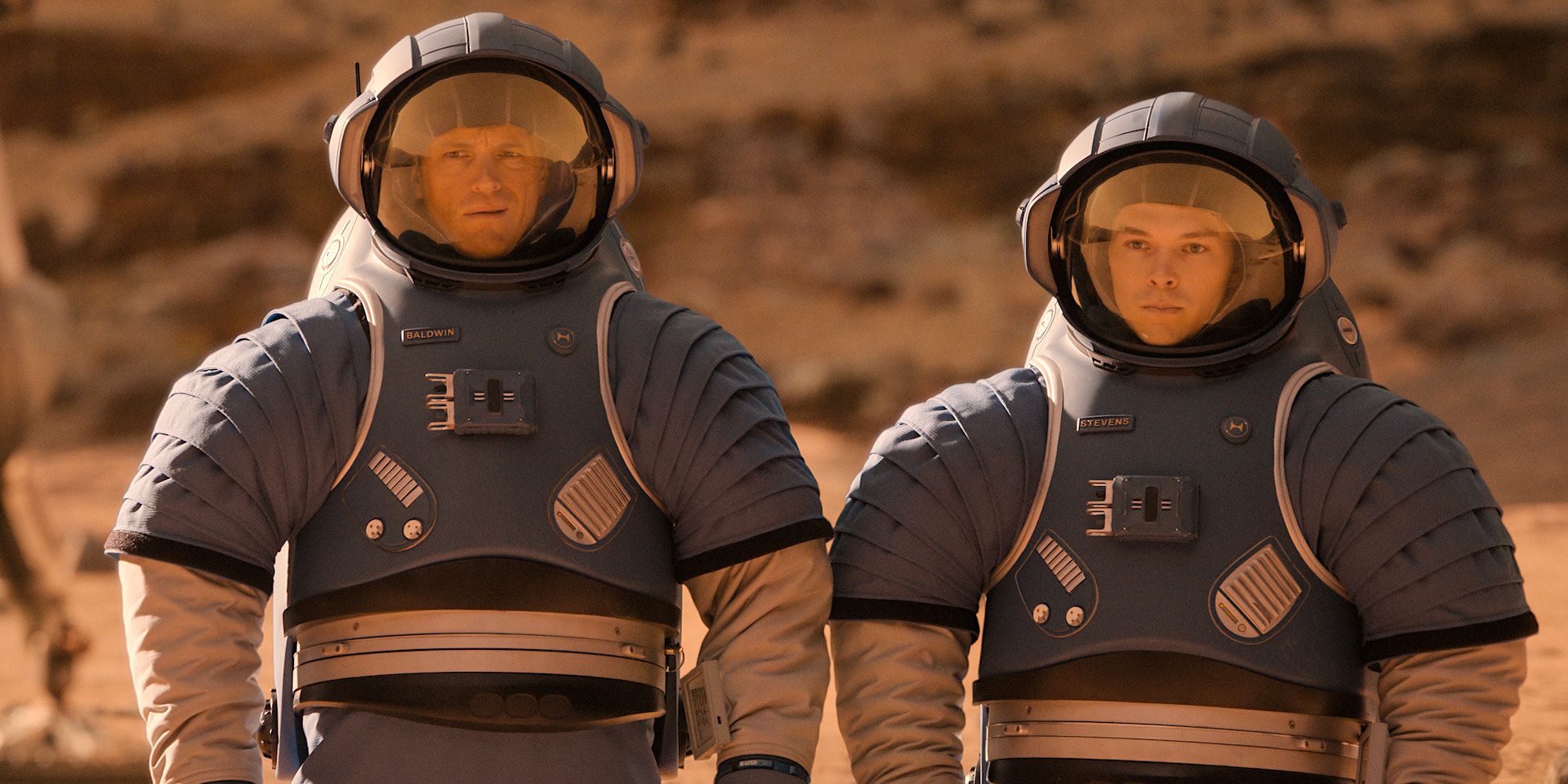 Ed Baldwin (Joel Kinnaman) and Danny Stevens (Casey W. Johnson) in blue space suits on Mars in For All Mankind season 3