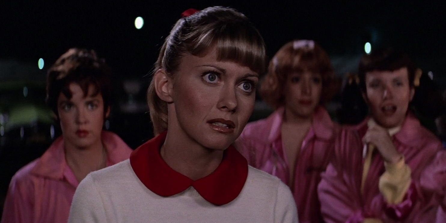 Sandy and The Pink Ladies looking upset in Grease
