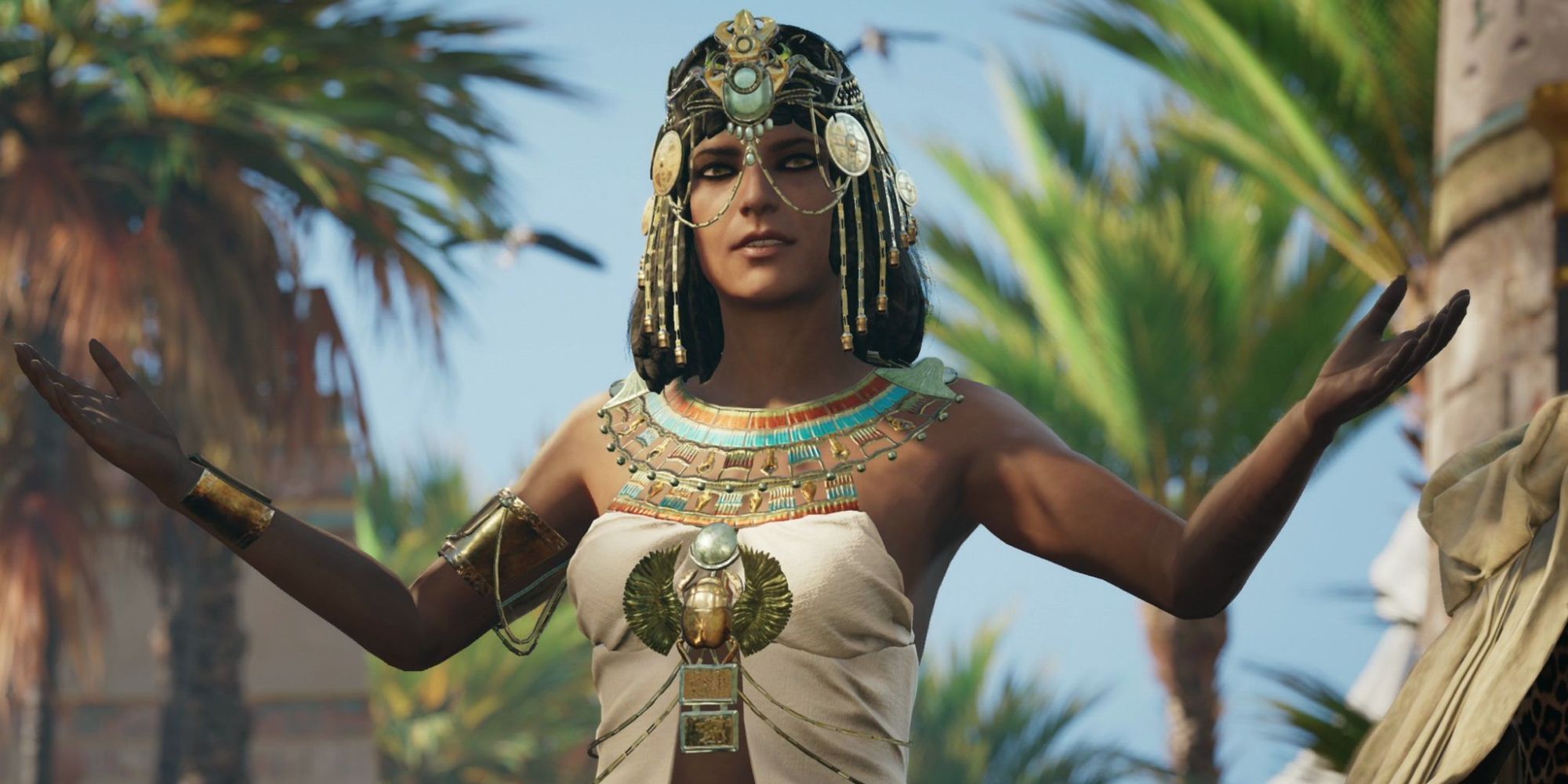 image of Cleopatra wearing ancient Egyptian clothes with hands raised in Assassins Creed Origins
