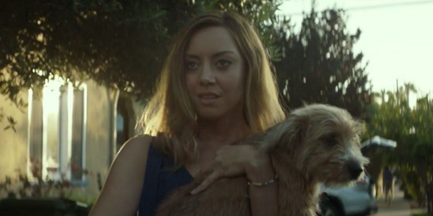 Aubrey holding a dog in Ingrid Goes West