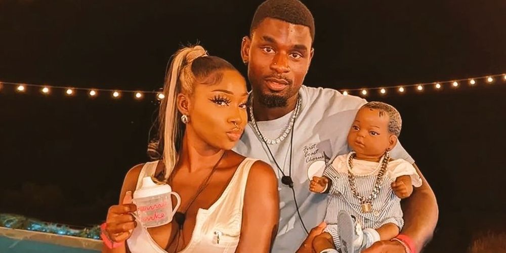 Indiyah and Dami pose with their baby on Love Island
