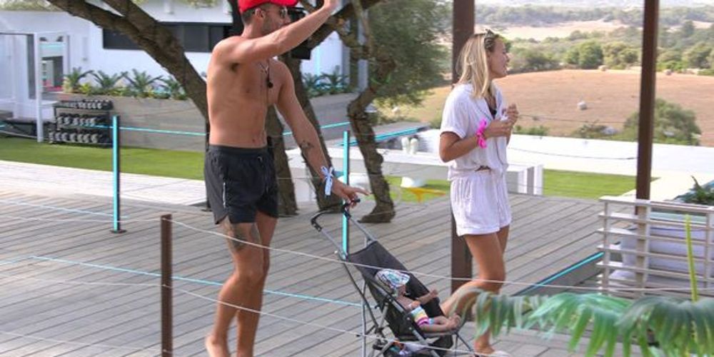 Liam and Millie walk their baby in a stroller on Love Island