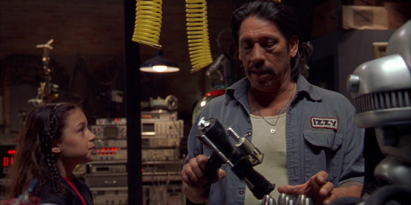 Machete showing the kids gadgets in Spy Kids