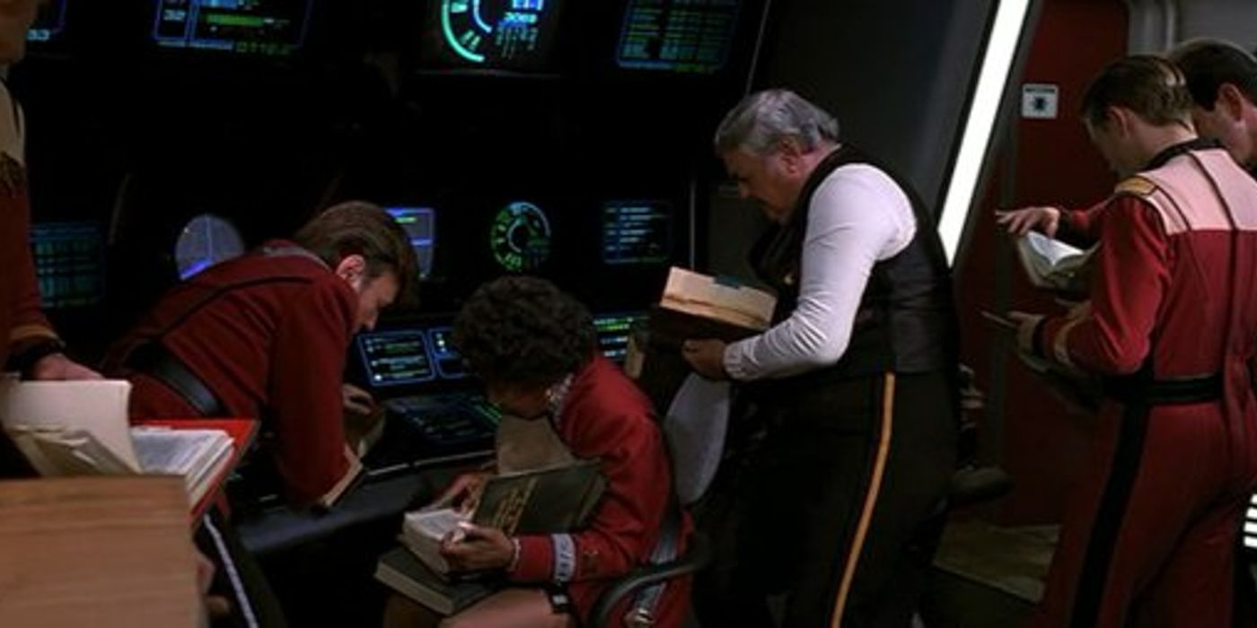 Image of the bridge crew crowding round Uhura at the comms station