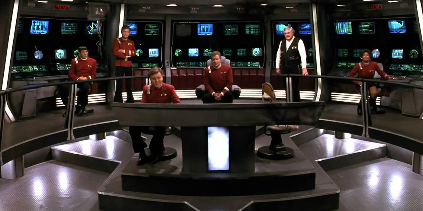 Image of the Star Trek family on the bridge looking at the camera