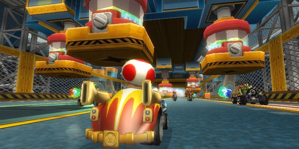 Toad drives through Toad's Factory in Mario Kart Wii