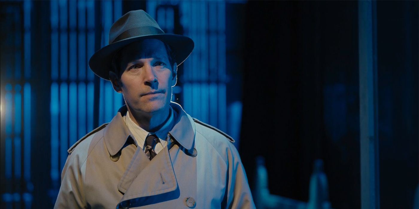 Paul Rudd as Ben, wearing a trench coat on a blue lit background in Only Murders in the Building.