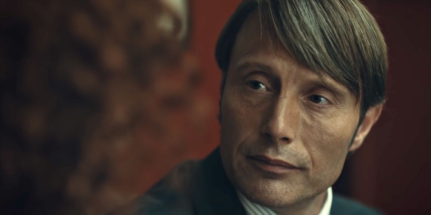 Mads Mikkelsen as Hannibal Lecter looking at someone offscreen in Hannibal