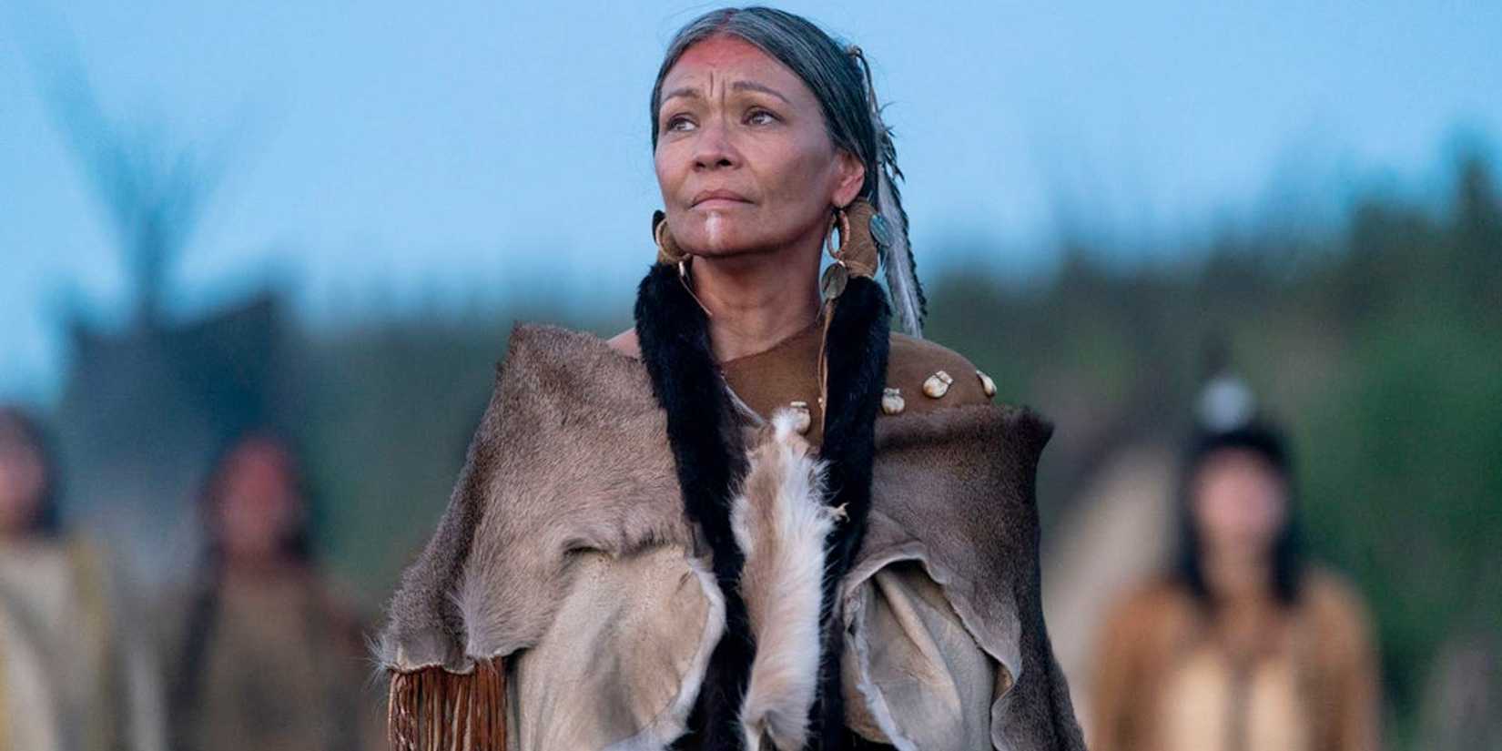 Michelle Thrush as Aruka looking on in Prey.
