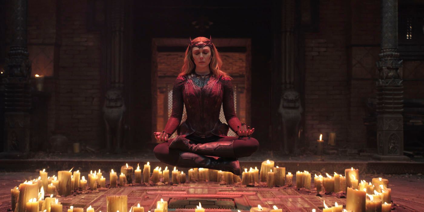 Elizabeth Olsen as Scarlet Witch in Doctor Strange in the Multiverse of Madness floating above candles