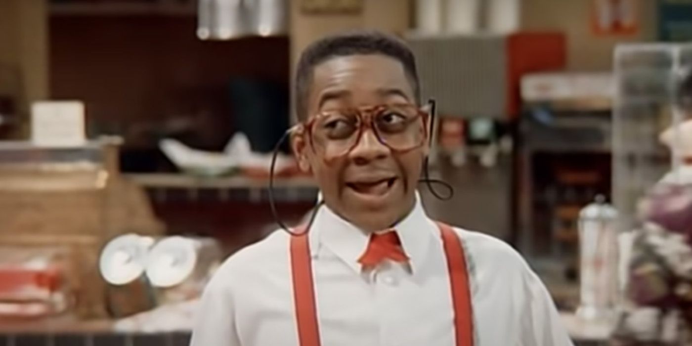 Steve Urkel from Family Matters wearing suspenders and glasses, in mid-sentence.