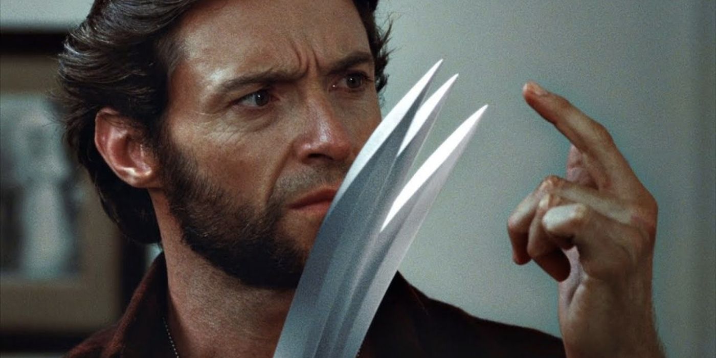 Wolverine looks at his claws in X Men