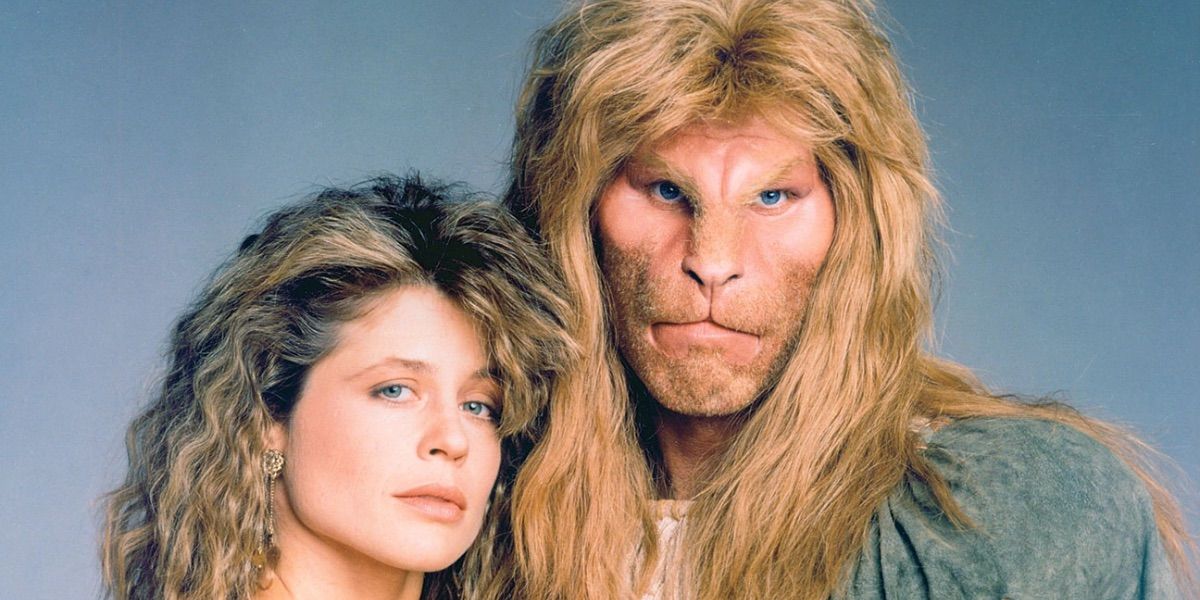 Ron Perlman and Linda Hamilton pose in a promotional image for Beauty and the Beast
