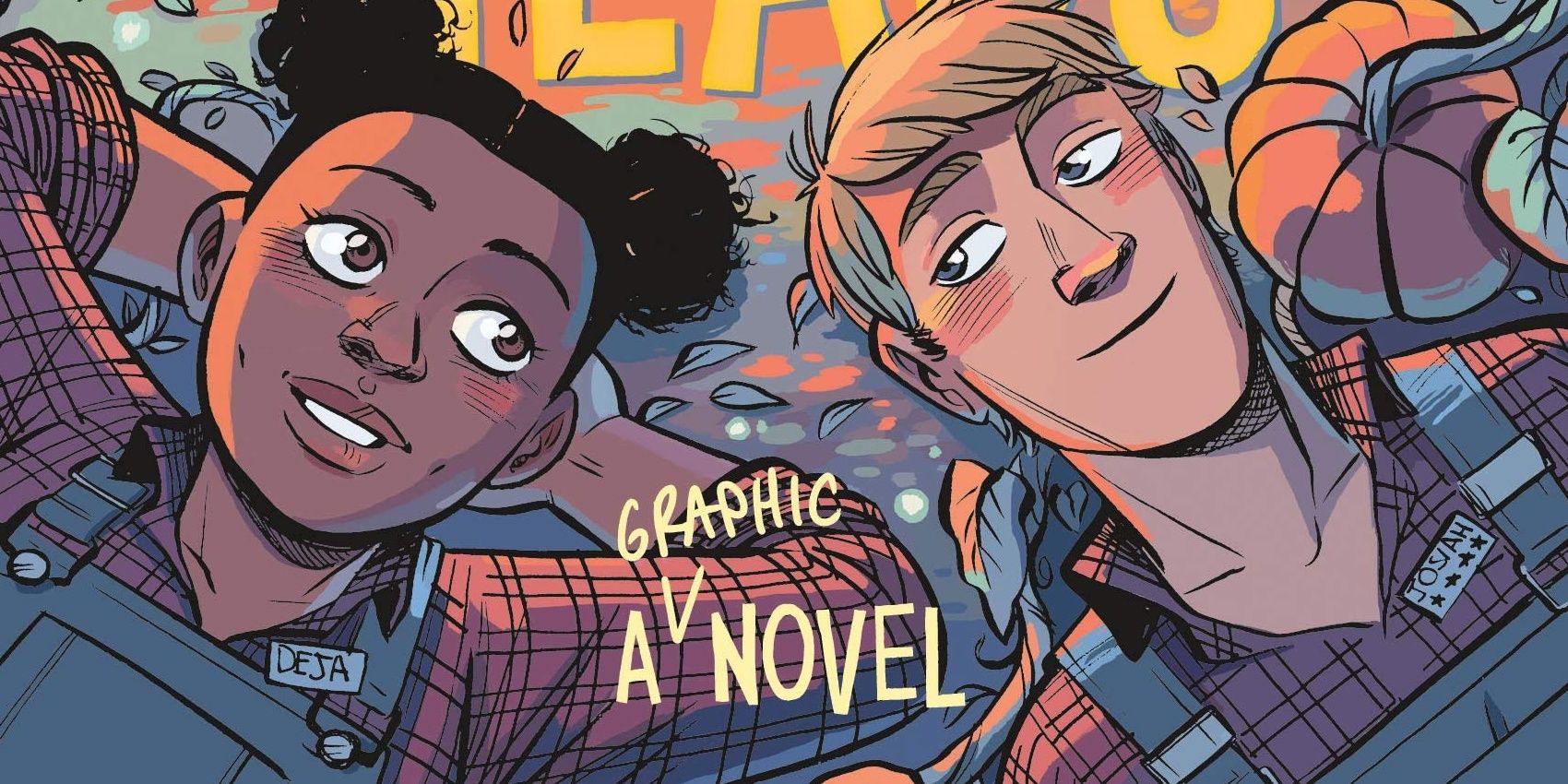 A teenage boy and girl lay in a pumpkin patch together