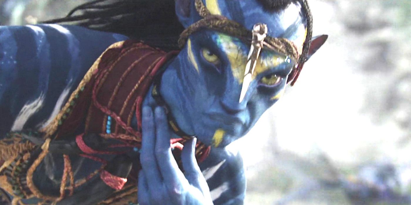 A Na'vi in James Cameron's Original Avatar looks intently into the camera during battle