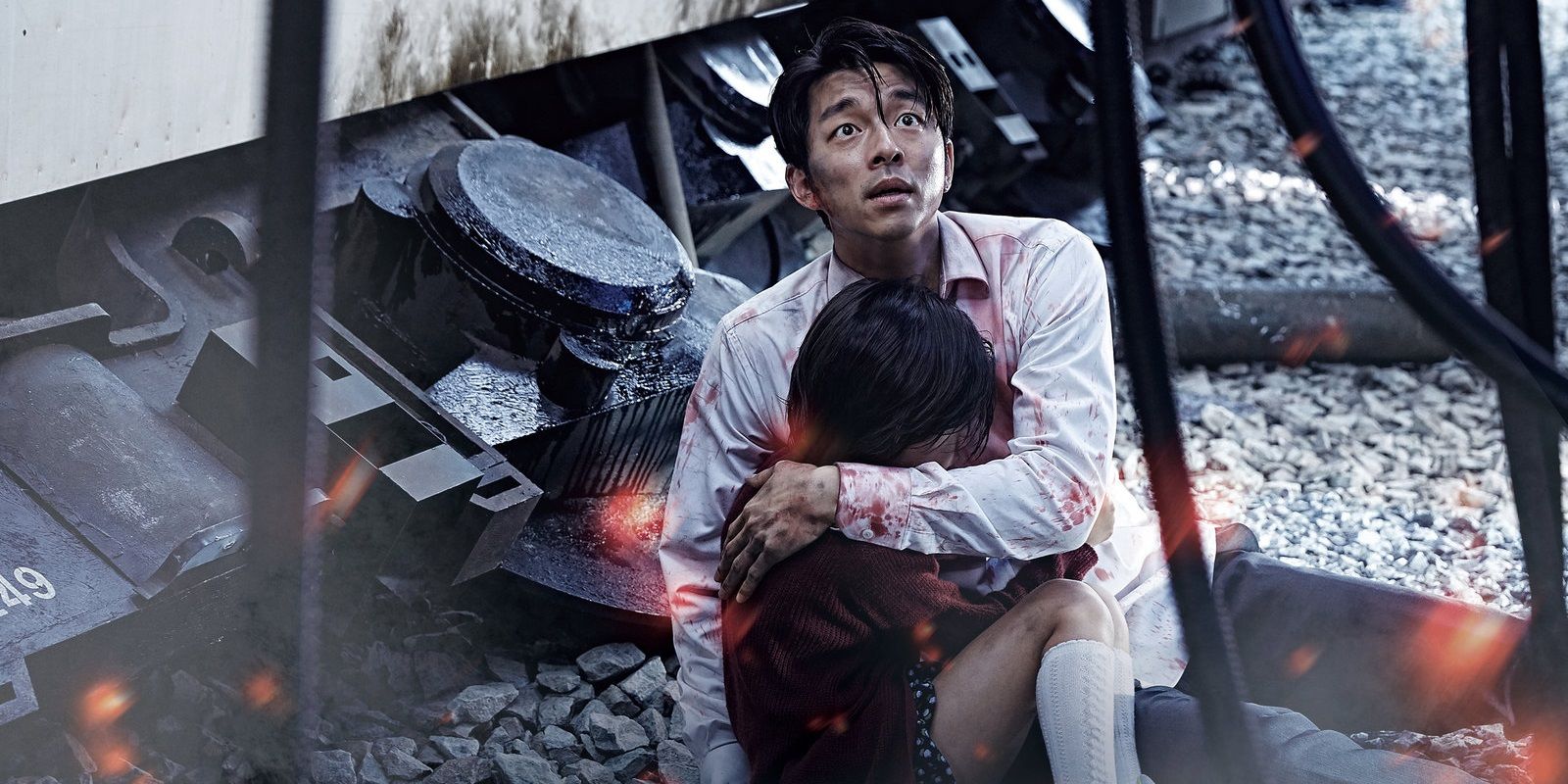 A father cradling his daughter in Train to Busan