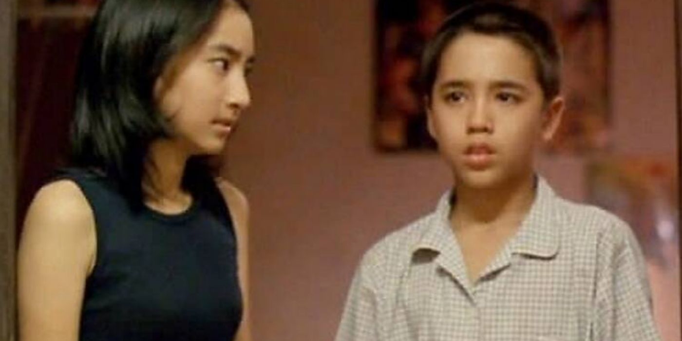 A scene from House of Ghosts with two characters staring
