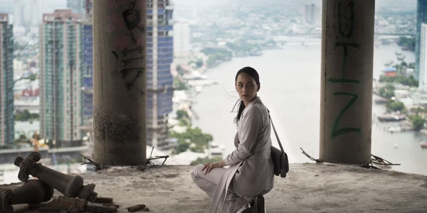 A scene from the Thai horror movie The Promise with a woman looking behind her