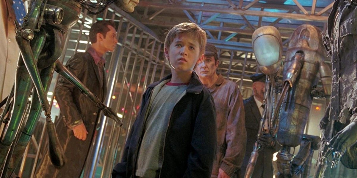 Haley Joel Osment cercado por robôs em AI Inteligência Artificial