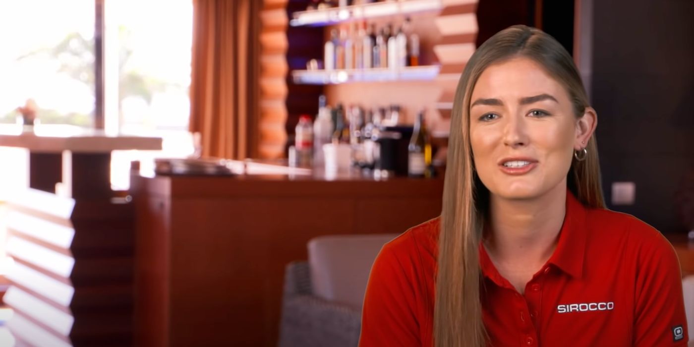  Aesha in a confessional for her first season on Below Deck Med in a red polo