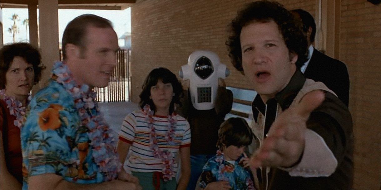 Albert Brooks gestures to the camera in Real Life