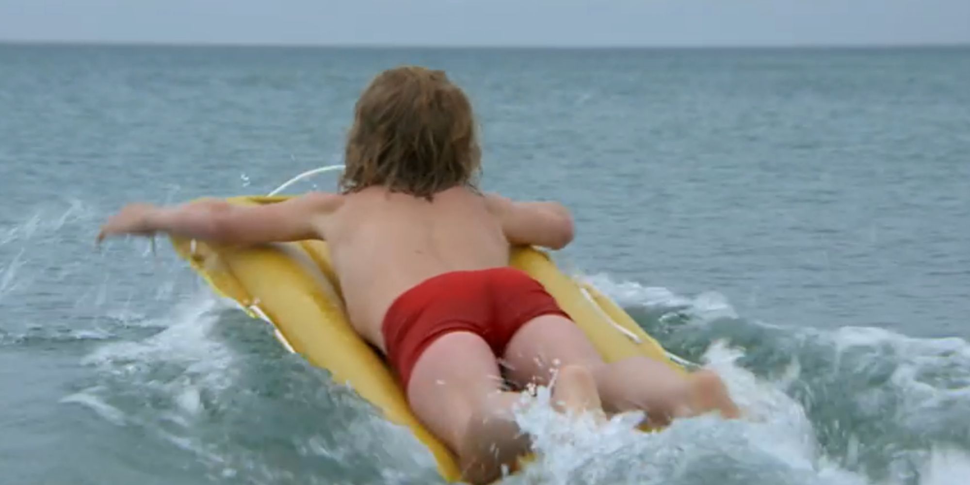 Alex Kintner going out into the ocean in Jaws (1975)
