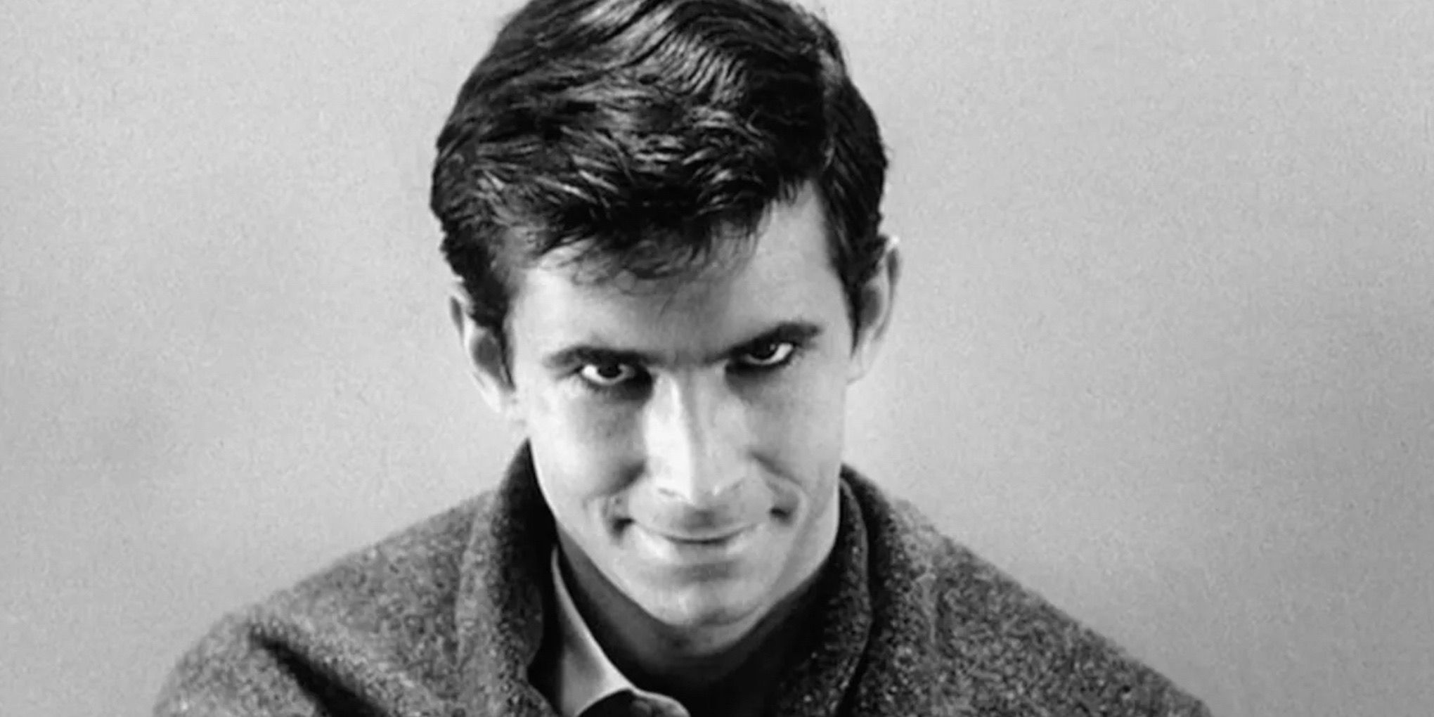 Anthony Perkins as Norman Bates staring at the camera in Psycho (1960)
