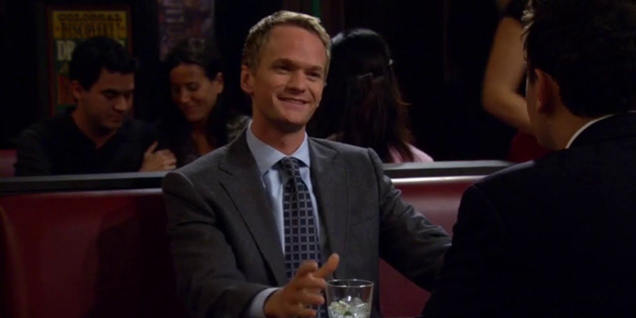 Barney laughing and having a drink in How I Met Your Mother 
