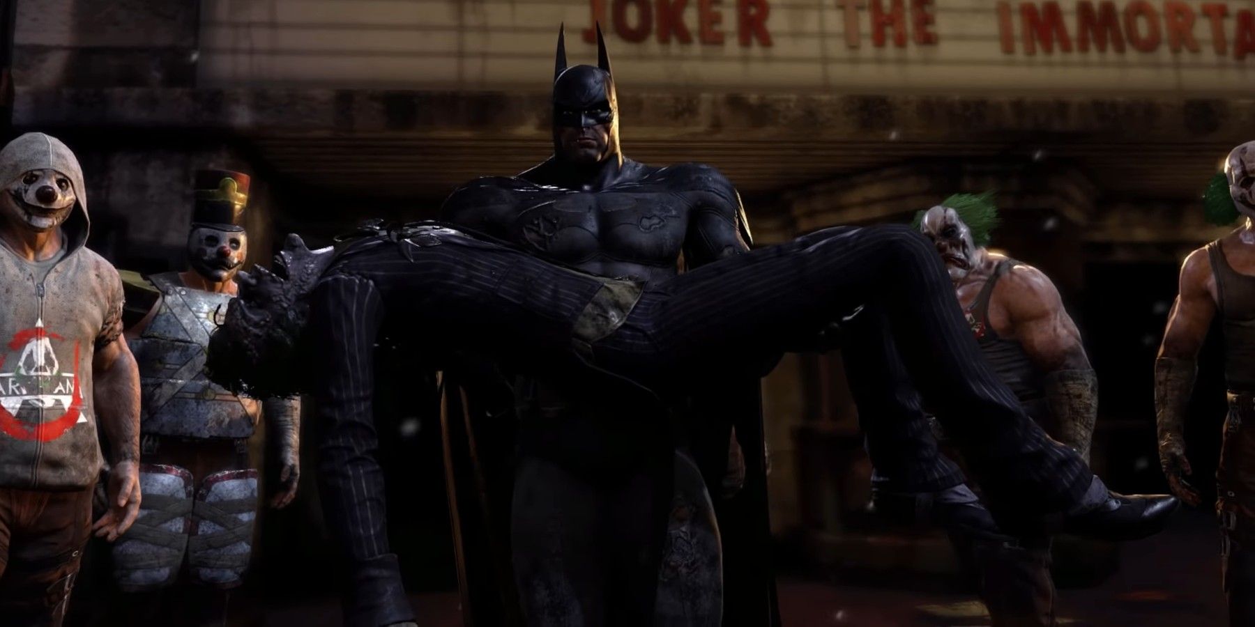 Batman portant le corps du Joker à Arkham City.
