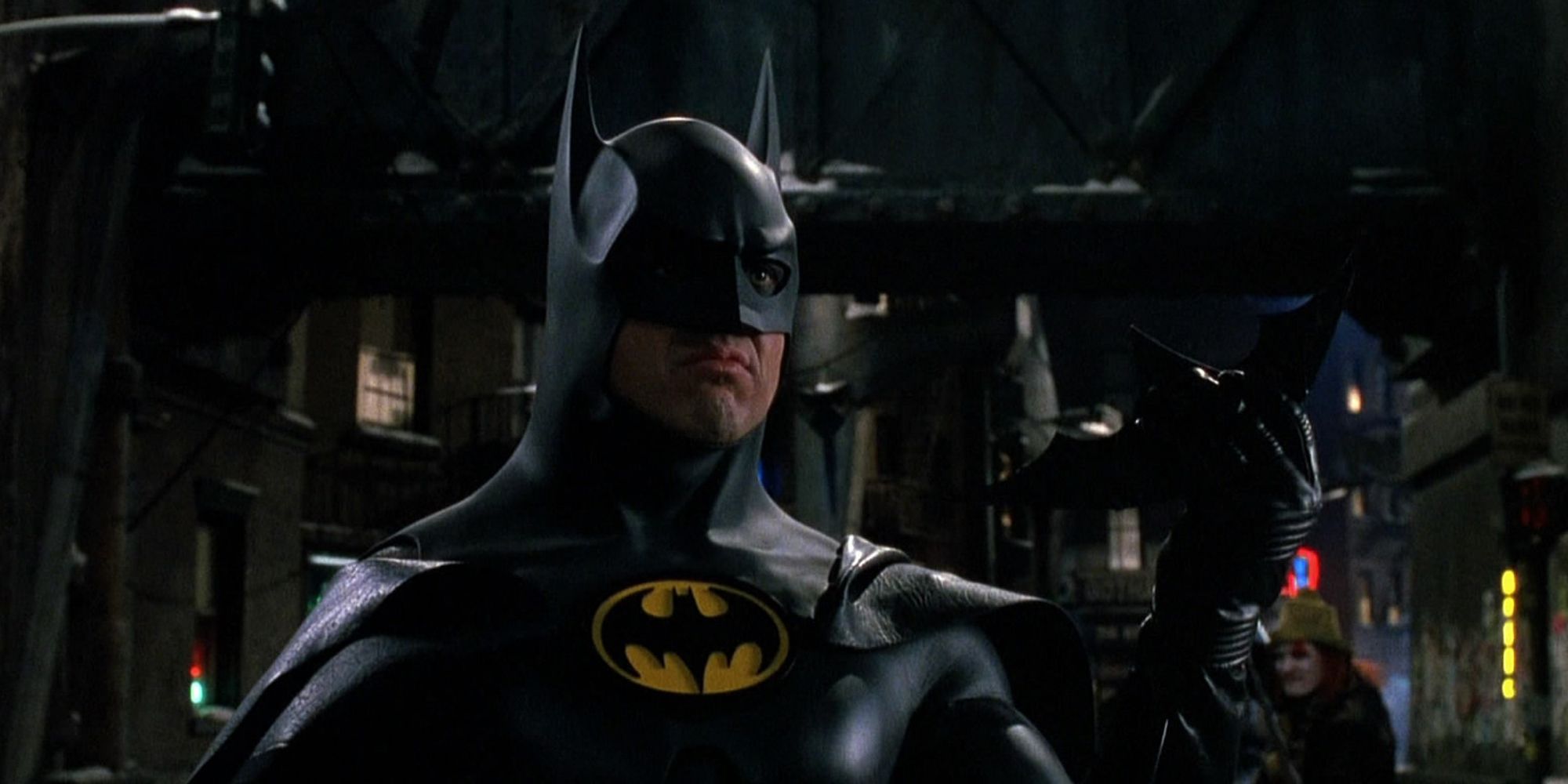 Batman readying a batarang in the street in Batman Returns (1992)