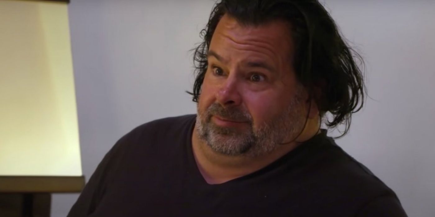 Big Ed Brown looking concerned on 90 Day Fiancé wearing black t shirt