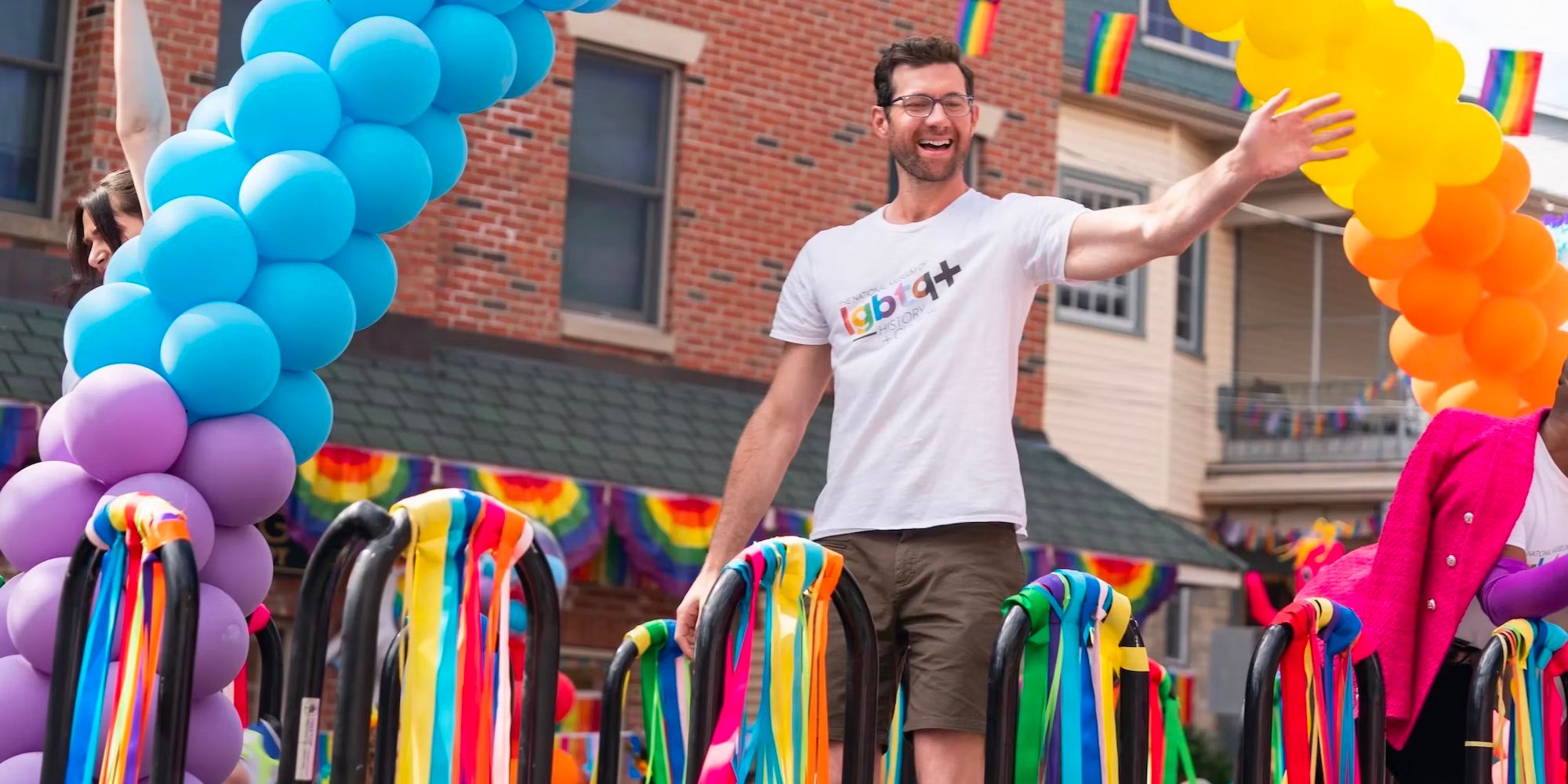 Billy Eichner as Bobby on a parade float in the movie Bros