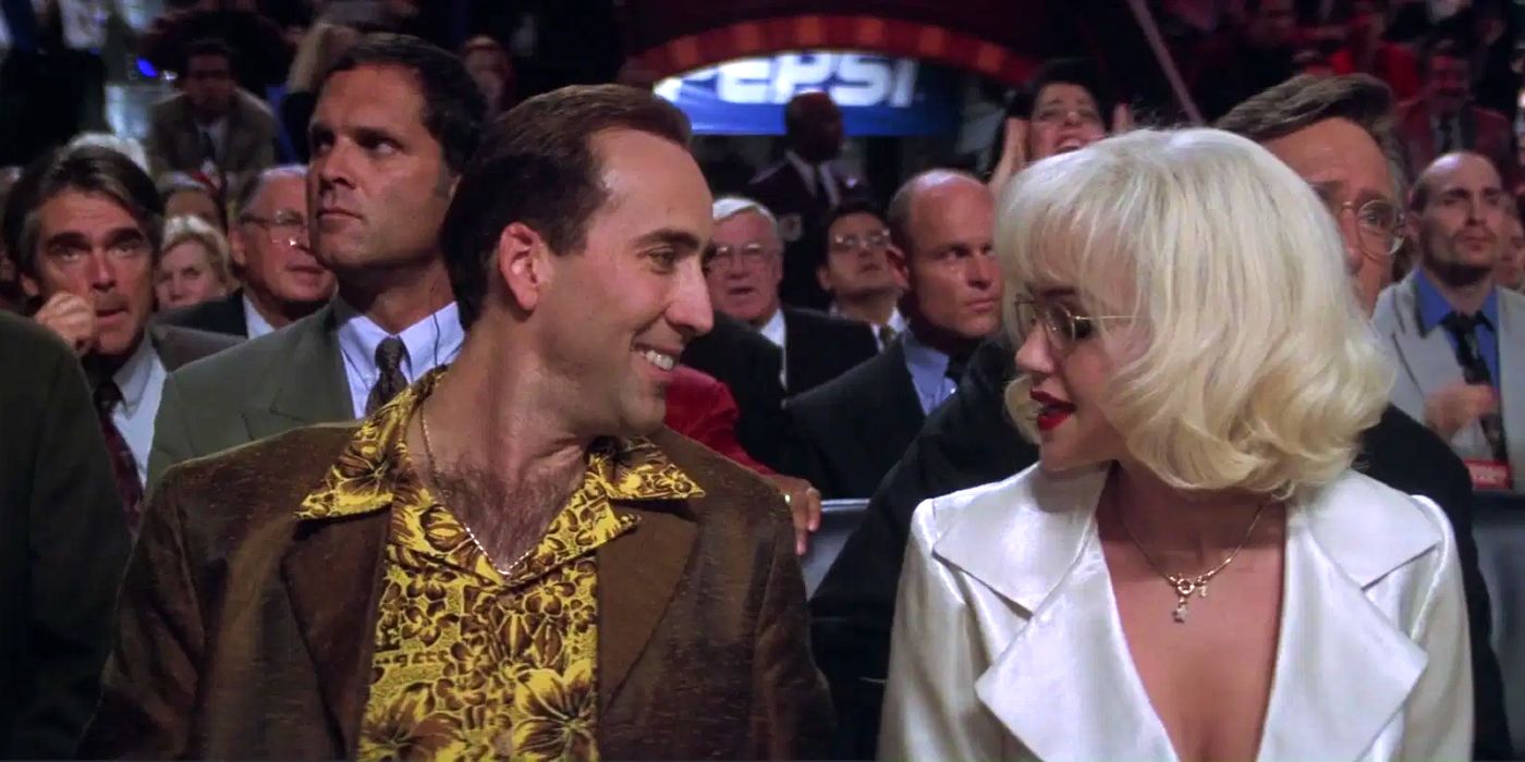 Nicolas Cage flirts with a woman at a boxing match in Snake Eyes