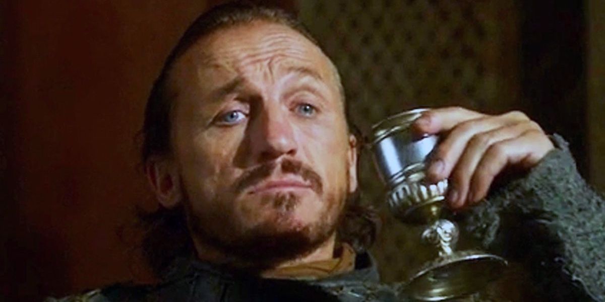 Bronn holding a goblet in Game of Thrones