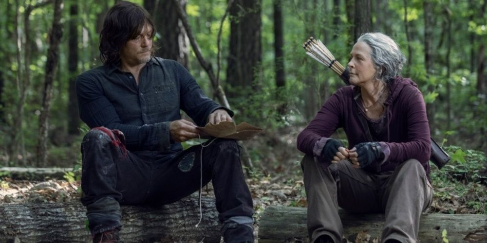 Carol and Daryl sitting in the woods in The Walking Dead 